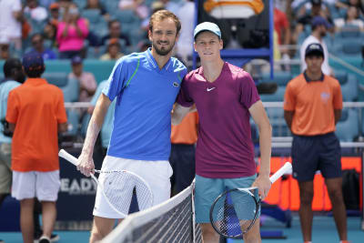 Daniil Medvedev of Russia, right, poses after winning the final