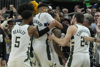 Giannis exits early with knee issue; Bucks rip Heat 128-99