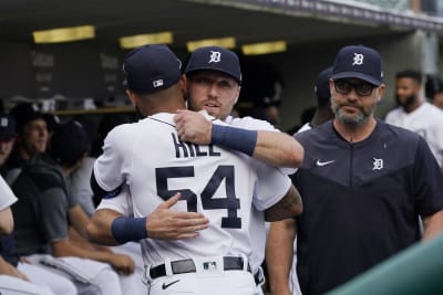 Former New York Yankees pitcher Roger Clemens talks with his son