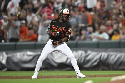 Baltimore Orioles' Jorge Mateo, left, reacts while running by