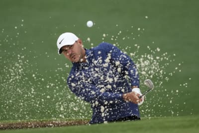 The Masters: Third round suspended as rain drenches field at