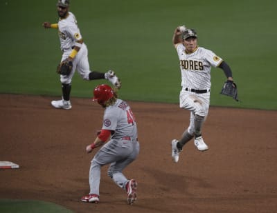 St. Louis Cardinals Harrison Bader makes a throw to first base in in