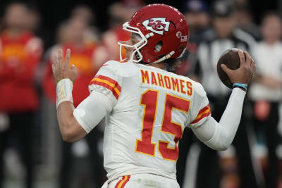 Patrick Mahomes Texas Tech Red Raiders Unsigned White Jersey Signaling with Fists to Helmet Photograph