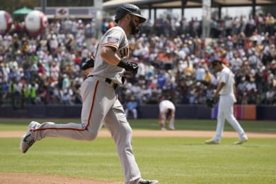 Mitch Haniger of the San Francisco Giants rounds the bases after