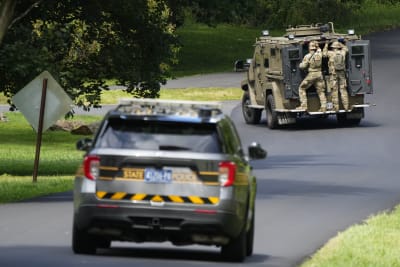 Heavily armed law enforcement officers move along Rt. 52 as the search  continues for Danilo Cavalcante in Pocopson Township, Pa., on Sunday, Sept.  3, 2023. Cavalcante escaped from the Chester County Prison.