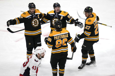 Bruins beat Devils 2-1, match NHL record with 62nd win