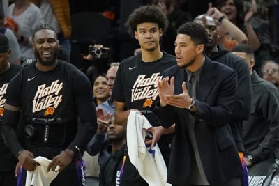 Devin Booker scores 23 in return, Suns roll past Heat to clinch playoff  spot