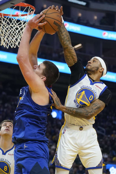 The Golden State Warriors' Stephen Curry defends against the Denver Nuggets'  Andre Iguodala (9) in the first quarter of Game 6 of their first-round NBA  Playoff series on Thursday, May 2, 2013