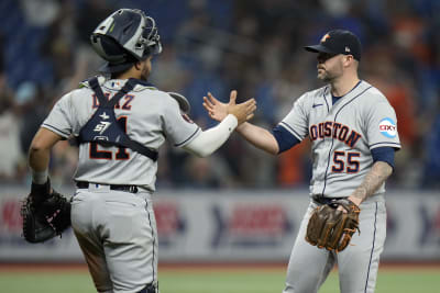 Houston Astros' Ryan Pressly (55) and Yainer Diaz celebrate after