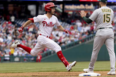 Philadelphia Phillies' Cristian Pache bunts for a single during