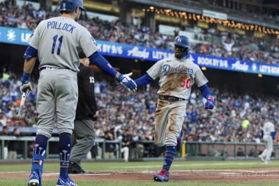 Giants beat Dodgers 3-2 in 11th on error, take NL West lead