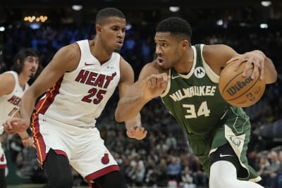 Antetokounmpo, Lillard help Bucks build big lead, hold off Heat in playoff  rematch