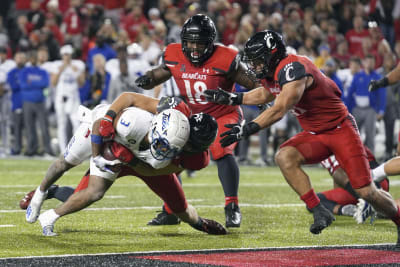 Cincinnati opens AAC defense with 31-21 win over Tulsa