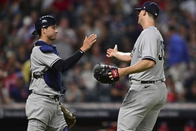 New York Yankees pitcher Clay Holmes, right, and Kyle Higashioka