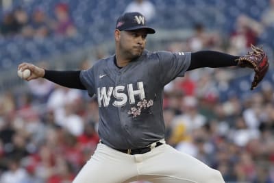 Blocking the plate call on review helps Nats top Padres 4-3