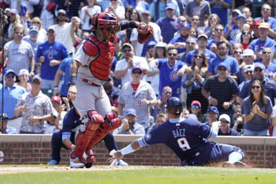 St. Louis Cardinals' Yadier Molina (4) is safe at home plate ahead