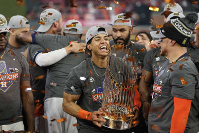 Abbott poses for pictures with Astros World Series trophy