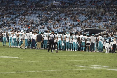 Daewood Davis of Dolphins carted off field after collision; preseason game  vs. Jaguars halted