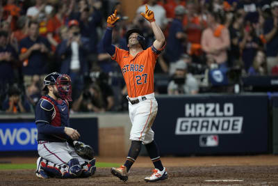 Correa bear-hugs Altuve after game-winner