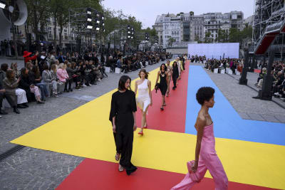 Vuitton transforms Paris with a playful spectacle of color, stars