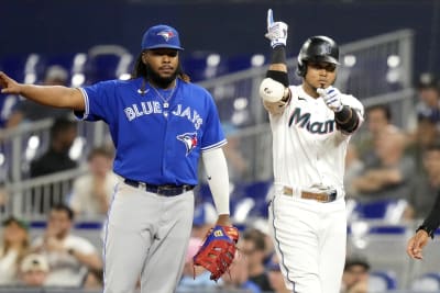 Miami Marlins first base coach Jon Jay (11) talks with Luis Arraez