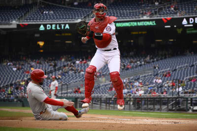 WASHINGTON, DC - APRIL 21: Washington Nationals left fielder Kyle Schwarber  (12) finishes a swing during the St. Louis Cardinals versus Washington  Nationals game at Nationals Park on April 21, 2021 in