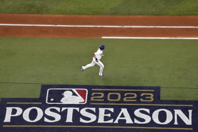 Texas Rangers' Corey Seager, left, Adolis Garcia, center, and Marcus Semien  celebrate the team's 5-2 win over the Chicago White Sox after a baseball  game Monday, June 19, 2023, in Chicago. (AP