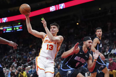 Young scores 41, Murray hits go-ahead 3 as the Hawks beat the Magic 120-119  in Mexico City