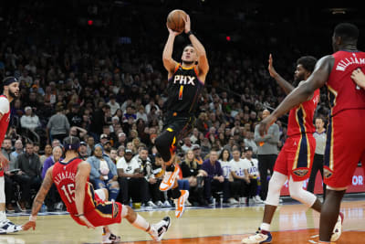 Devin Booker scores 23 in return, Suns roll past Heat to clinch playoff  spot