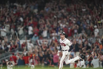 Heartwarming Moment: Freddie Freeman Embracing Dansby Swanson