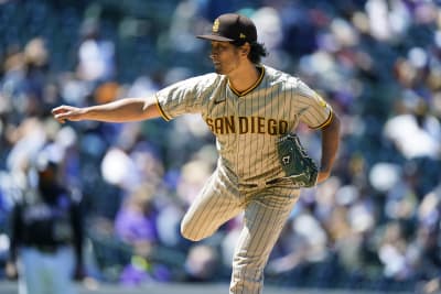 San Diego Padres starting pitcher Yu Darvish celebrates after