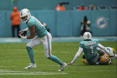 Tua, Dolphins outlast Bears on Fields' record rushing day