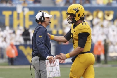 Nicco Marchiol throws TD pass in 1st start West Virginia holds