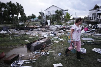 Residents pick through the rubble of lost homes and scattered belongings in  Hurricane Idalia's wake