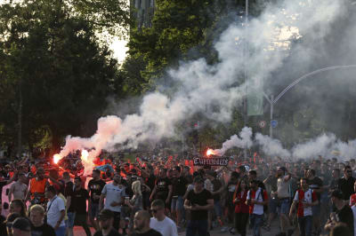 FK Tirana ultras storm pitch and attack officials after late