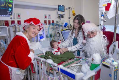 See photos of Santa visiting with tiny babies in a NICU