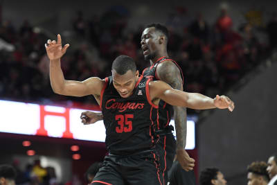 White scores 21 No. 14 Houston beats SMU 75 61