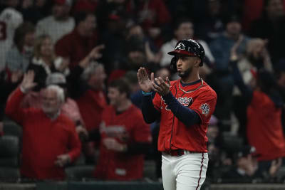 Atlanta, USA. 29th Oct, 2021. Atlanta Braves Eddie Rosario is congratulated  by Austin Riley after scoring in the 3rd inning in game three against the  Houston Astros of the MLB World Series