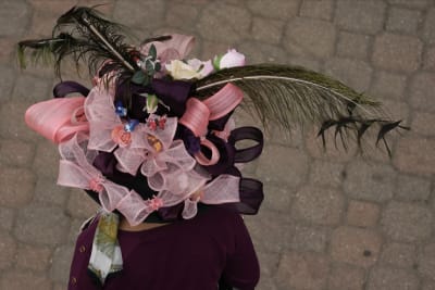 AP PHOTOS: Kentucky Derby hat styles: Bigger is often better