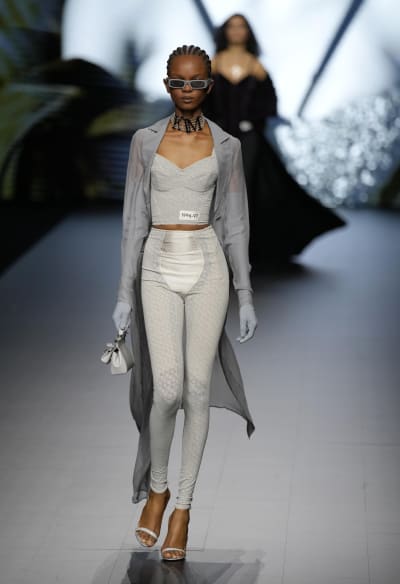 D&G Milan Ready to Wear Spring Summer Model wearing white trousers