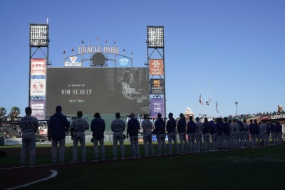 A patch honoring broadcaster Vin Scully is shown on the jersey of