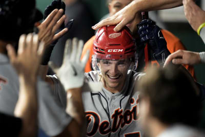 Willy Adames wears hockey helmet in the dugout