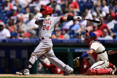 Philadelphia Phillies' Bryson Stott, center, celebrates his walkoff home  run with Bryce Harper, right, Alec Bohm, left, during the ninth inning of a  baseball game against the Los Angeles Angels, Sunday, June