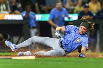 Tampa Bay Rays pitching coach Kyle Snyder, left, looks on as Shane