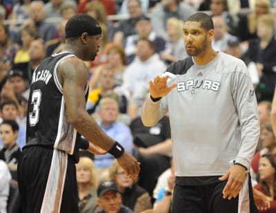 San Antonio Spurs center Tim Duncan watches from the bench in