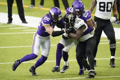 FILE - Minnesota Vikings running back Alexander Mattison (2) breaks a  tackle to score a touchdown in the first quarter of an NFL match between  Minnesota Vikings and New Orleans Saints at