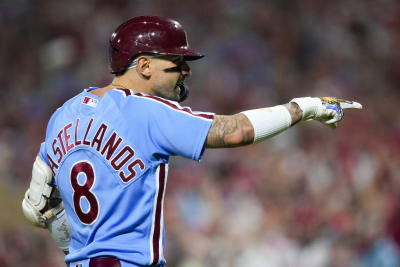 Philadelphia Phillies - Photo of Nick Castellanos wearing the powder blue  Phillies jersey in the dugout.