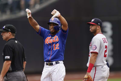 July 23, 2019: Chicago Cubs shortstop Javier Baez (9) signals