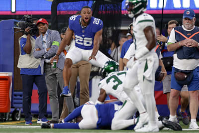 New York, USA. August 8, 2019, East Rutherford, New Jersey, USA: New York  Giants quarterback Daniel Jones (8) celebrates with running back Saquon  Barkley (26) after throwing his first touchdown pass during