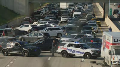 Massive sign knocked down by wind closes I-95 highway and IKEA in